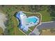 Community pool and clubhouse with a metal roof at 4007 Capensis Ln, Ravenel, SC 29470