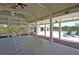 Spacious covered patio with rocking chairs and pool views at 4007 Capensis Ln, Ravenel, SC 29470