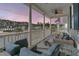 Relaxing porch with wicker furniture and water view at 4007 Capensis Ln, Ravenel, SC 29470