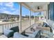 Relaxing porch with wicker furniture and lake view at 4007 Capensis Ln, Ravenel, SC 29470
