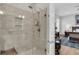Walk-in shower with glass enclosure, tiled walls, and built-in bench at 4007 Capensis Ln, Ravenel, SC 29470