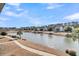 Scenic pond view with community homes at 4007 Capensis Ln, Ravenel, SC 29470