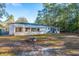 House features a spacious backyard with a fire pit and storage shed at 411 Constance St, Walterboro, SC 29488