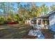 Backyard view showing screened porch, grill, and storage shed at 411 Constance St, Walterboro, SC 29488