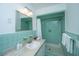Bathroom with mint green tile and a shower/tub combo at 411 Constance St, Walterboro, SC 29488