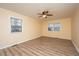 Empty bedroom with light walls, wood flooring, and ceiling fan at 411 Constance St, Walterboro, SC 29488