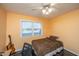 Bright bedroom with a double bed, guitar, and window at 411 Constance St, Walterboro, SC 29488