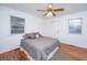 Bright bedroom with hardwood floors and gray bedding at 411 Constance St, Walterboro, SC 29488