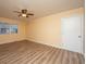 Spacious bedroom with light walls, wood flooring, and ceiling fan at 411 Constance St, Walterboro, SC 29488