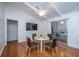 Bright dining area with white table, four brown chairs, and hardwood floors at 411 Constance St, Walterboro, SC 29488