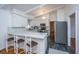 Modern kitchen with white cabinets, marble countertops, and stainless steel appliances at 411 Constance St, Walterboro, SC 29488