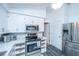 Modern kitchen with stainless steel appliances and white cabinets at 411 Constance St, Walterboro, SC 29488