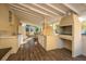 Outdoor kitchen with grill, pizza oven, and refrigerator at 411 Constance St, Walterboro, SC 29488