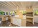 Outdoor kitchen with grill, pizza oven, and refrigerator at 411 Constance St, Walterboro, SC 29488