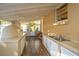 Outdoor kitchen features a wood-fired oven, stainless steel sink, and ample counter space at 411 Constance St, Walterboro, SC 29488
