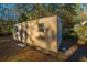 Tan metal storage shed with double doors and windows at 411 Constance St, Walterboro, SC 29488