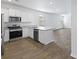 Modern kitchen with white cabinets, granite countertops, and stainless steel appliances at 415 Broad Elm Way, Summerville, SC 29486