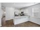 Modern kitchen with white cabinets, granite countertops, and stainless steel appliances at 415 Broad Elm Way, Summerville, SC 29486
