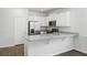 Modern kitchen with white cabinets, granite countertops, and stainless steel appliances at 415 Broad Elm Way, Summerville, SC 29486
