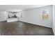 Open living room with hardwood floors and kitchen access at 415 Broad Elm Way, Summerville, SC 29486