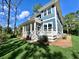 Two-story home with screened porch and landscaped yard at 4235 Royal Harbor Rd, Hollywood, SC 29449