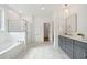 Modern bathroom with marble flooring, a soaking tub, walk-in shower, and double vanity at 457 Eagleview Dr, Moncks Corner, SC 29461