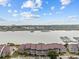 Aerial view of waterfront homes and community with a marina at 48 Mariners Cay Dr, Folly Beach, SC 29439