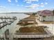 Aerial view of waterfront property with boat slips and community amenities at 48 Mariners Cay Dr, Folly Beach, SC 29439