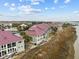Waterfront townhomes with a marsh view and palm trees at 48 Mariners Cay Dr, Folly Beach, SC 29439