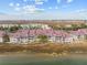 Waterfront townhomes with red roofs and a marsh view at 48 Mariners Cay Dr, Folly Beach, SC 29439
