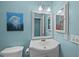 Bathroom with white vanity, sink, and mirror at 48 Mariners Cay Dr, Folly Beach, SC 29439