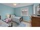 Bedroom with two twin beds, nightstand, and dresser at 48 Mariners Cay Dr, Folly Beach, SC 29439