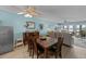 Bright dining area with a wooden table and chairs, adjacent to the kitchen at 48 Mariners Cay Dr, Folly Beach, SC 29439