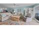 Comfortable living room featuring beige sofas and a cozy atmosphere at 48 Mariners Cay Dr, Folly Beach, SC 29439