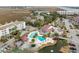 Community pool and tennis court with lush landscaping at 48 Mariners Cay Dr, Folly Beach, SC 29439