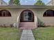 Back porch with brick steps and arched entry at 506 Gross Ave, Moncks Corner, SC 29461