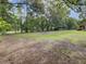 Large backyard with mature trees and grass at 506 Gross Ave, Moncks Corner, SC 29461