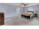 Bright bedroom featuring a queen-size bed and ceiling fan at 506 Gross Ave, Moncks Corner, SC 29461