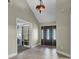 Bright entryway with tile floors and a chandelier at 506 Gross Ave, Moncks Corner, SC 29461
