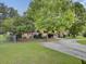 House exterior featuring a curved driveway and red shutters at 506 Gross Ave, Moncks Corner, SC 29461