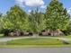 House exterior with a circular driveway and red shutters at 506 Gross Ave, Moncks Corner, SC 29461