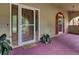 Inviting front porch with a wooden door and terracotta flooring at 506 Gross Ave, Moncks Corner, SC 29461