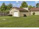 Detached garage with a white door and large yard at 506 Gross Ave, Moncks Corner, SC 29461