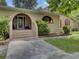Tan house exterior with arched entryway and landscaping at 506 Gross Ave, Moncks Corner, SC 29461