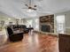 Open living room with hardwood floors and a view of the kitchen at 506 Gross Ave, Moncks Corner, SC 29461