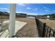Private backyard with patio, pond view, and black metal fence at 515 Purple Finch Rd, Summerville, SC 29486
