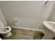 Small powder room with pedestal sink and toilet at 515 Purple Finch Rd, Summerville, SC 29486