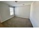Simple bedroom with neutral walls, carpet, and window with blinds at 515 Purple Finch Rd, Summerville, SC 29486