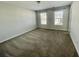 Bright bedroom with neutral colored walls and carpeted floor at 515 Purple Finch Rd, Summerville, SC 29486