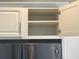 Open upper kitchen cabinet with empty shelves at 515 Purple Finch Rd, Summerville, SC 29486